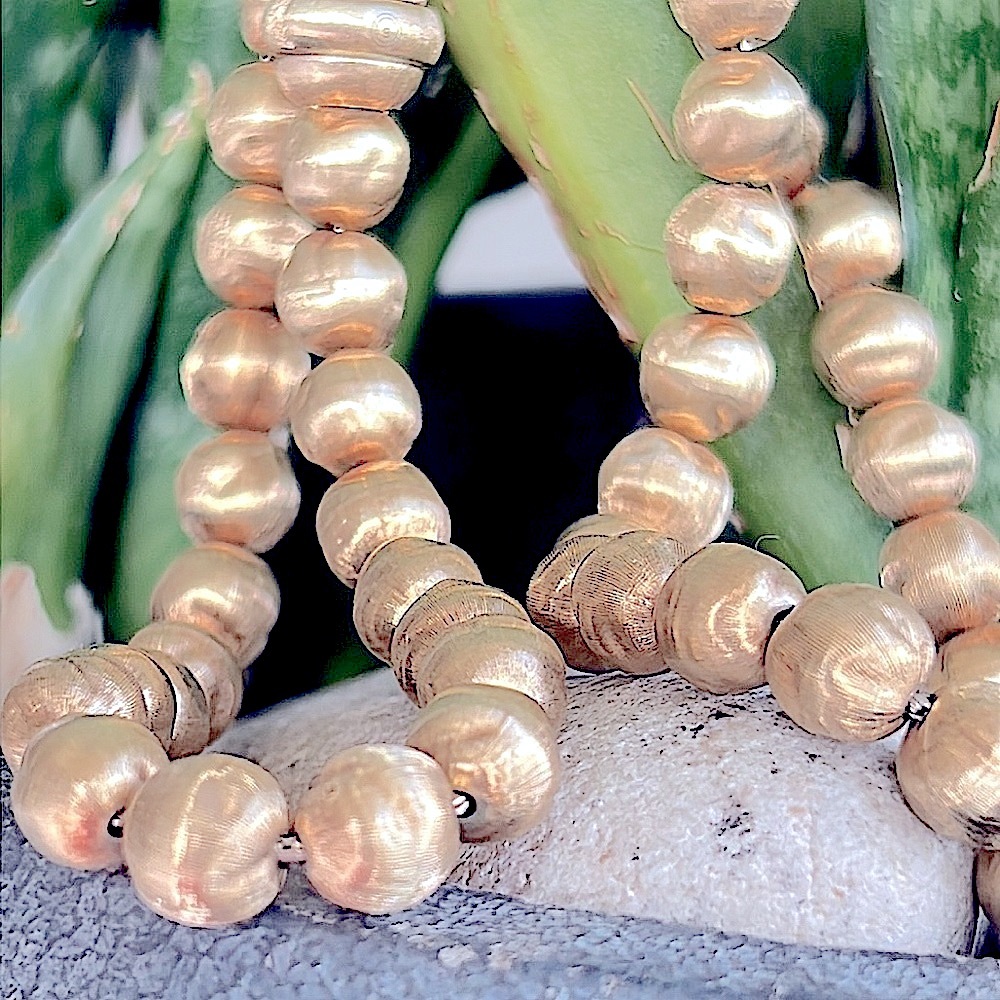 Sold.  
14 karat gold ball necklace